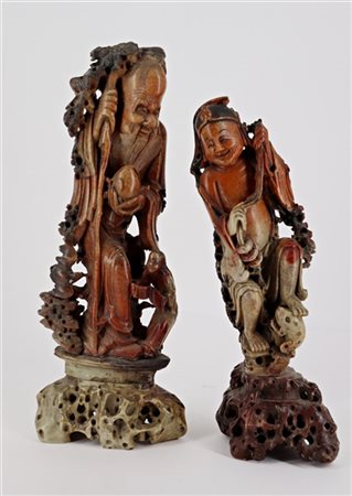 Due sculture in pietra saponaria raffiguranti divinità 
Cina, secolo XIX/XX
(h