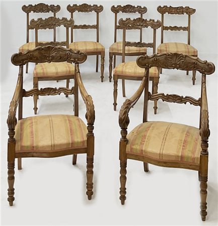 Lotto composto da due poltrone e sei sedie in noce intagliato con braccioli ter