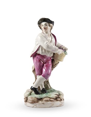 Manifattura francese, secolo XVIII. Figura di giovane con cappello e cesto d'uv