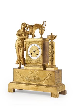 Autran fils. Pendola in bronzo dorato con base a plinto sormontata da figura mi