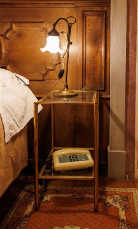 Coppia di tavolini in ferro dorato