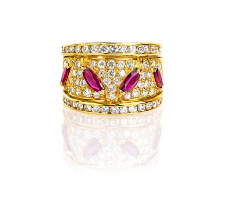 Anello in oro, brillanti e rubini.