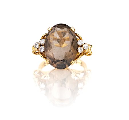 Anello in oro giallo, topazio e brillanti