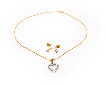 Pendente e coppia di orecchini in oro e pietre incolori.