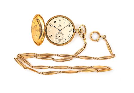 Omega, orologio da tasca in oro savonette con catena in oro