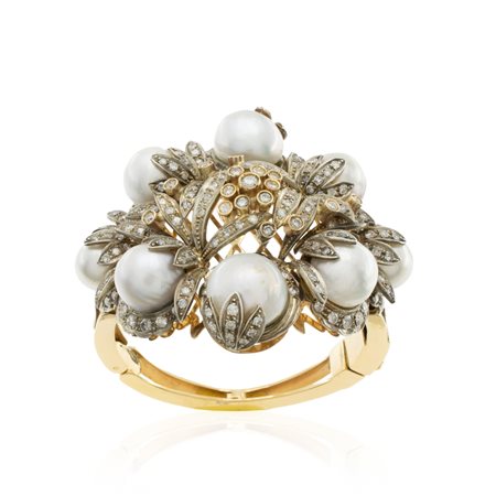 Bracciale a manetta in oro giallo 18kt e argento  peso 98 gr.