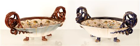 Coppia di centrotavola in maiolica con anse serpentiformi e zampe leonine. Manifattura A. Ciulli, inizi del XX secolo.   