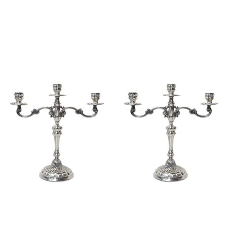 Coppia di candelieri in argento a tre luci