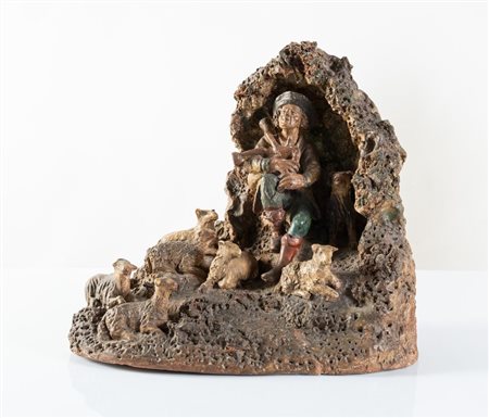Presepe in terracotta, raffigurante figura di pastore con zampogna, cane e...
