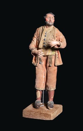 Figura da presepe in cartapesta e stoffa. Arte napoletana, XIX secolo. Cm...