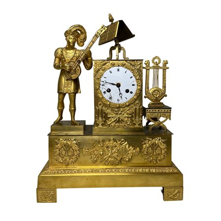 Orologio in bronzo dorato, periodo impero. Francia XIX secolo. Dimensioni...