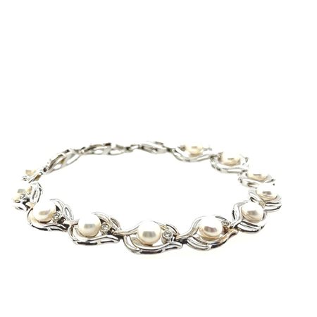 BRACCIALETTO IN ORO BIANCO 13.88 GR CON PERLE E DIAMANTI – AI30501