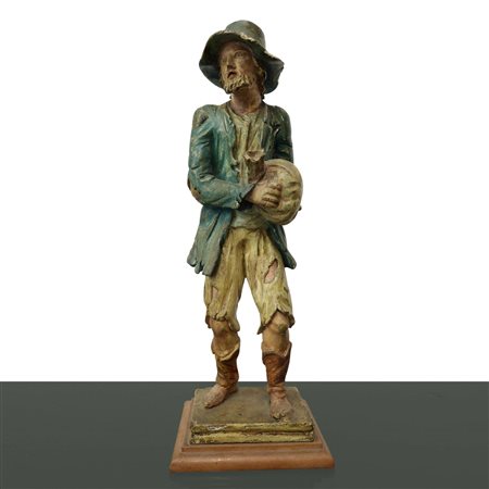 Uomo con sacco in mano in legno policromo, 20° secolo