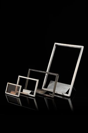 Quattro porta-menù. Milano, anni '30/'40. Alpacca. Marcati a incussione "Alemag