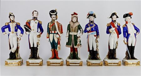 Manifattura del secolo XX. Gruppo di sette statuette in porcellana policroma ra