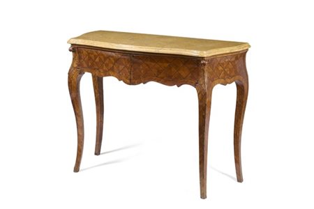 Tavolo da parete di forma mossa lastronato in legni vari e filettato a motivo g