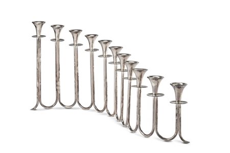 Grande portacandele centrotavola in argento a undici fiamme. Milano, argentiere
