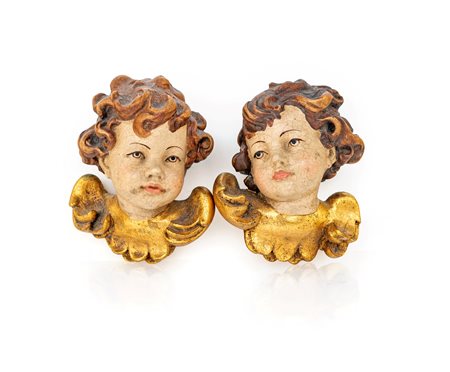 Coppia di piccole teste di cherubino in legno laccato e dorato cm 12x10