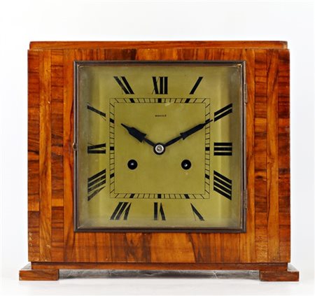 Kienzle. Pendoletta da scrivania con cassa lastronata. Quadrante in metallo a c