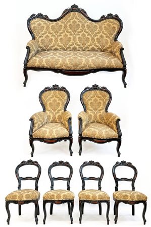 Fornitura da salotto in legno intagliato ed ebanizzato con inserti in radica co