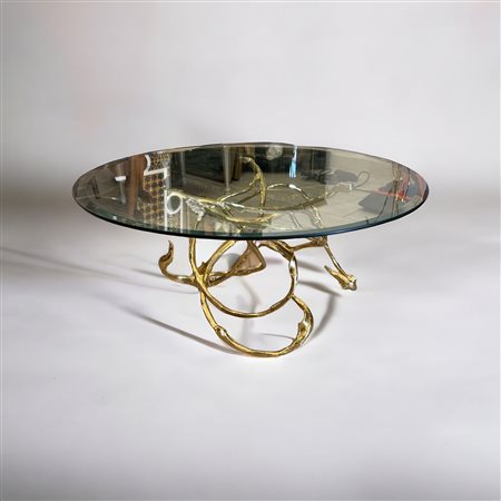  
Tavolino con base in ottone e piano in cristallo XX secolo
 H 39 x D 90 cm