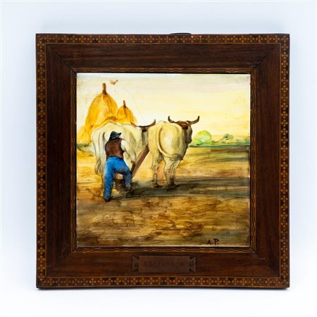 Mattonella maiolicata raffigurante aratura con buoi. Siglata "A.P." in basso a destra. In cornice   Società Ceramica Monino Gualdo Tadino