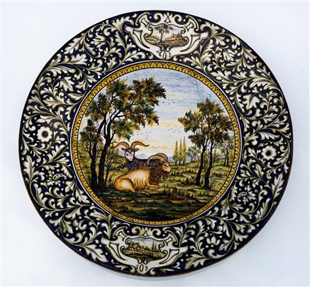 Grande piatto R. Troisi Castelli con girali e paesaggi alla tesa e coppia di arieti   