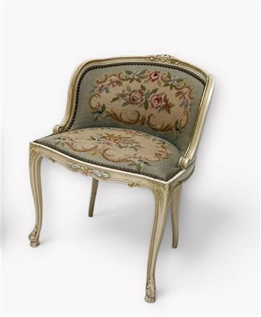A Louis XV style ladies' armchair with an embroidered seat and backrest.