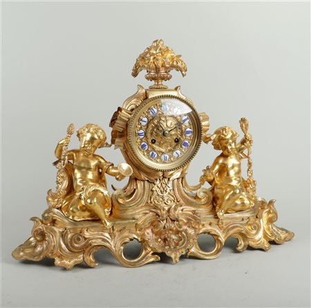 An imposing large fire-gilt mantel clock with puti, movement made by Vincenti...