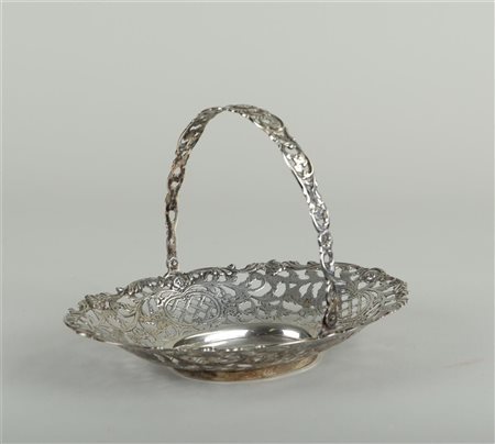 A silver, openwork bonbon basket with handle, decorated with floral motifs...