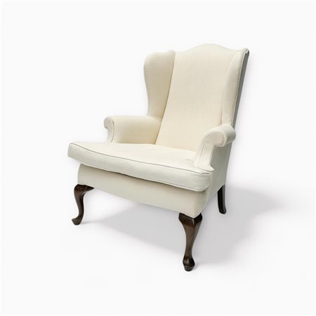 A wing chair upholstered in white linen fabric in very good condition....