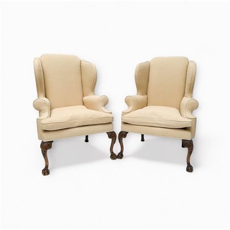 A set of (2) ecru linen upholstered wing chairs in very good condition. Claw...