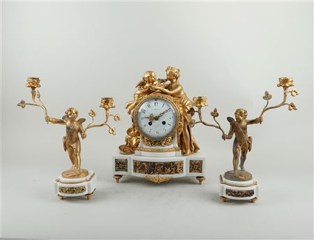 A fire-gilt and white marble Napoleon III Garniture de Cheminée, on the...