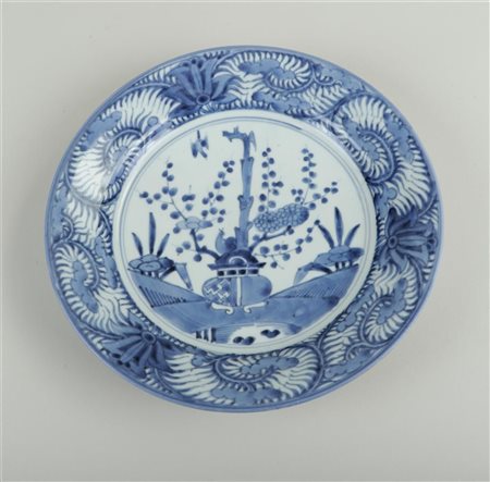 A porcelain dish with a decoration of a vase and flowers. Japan, 17th...