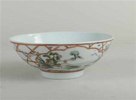 A porcelain famile rose decor with landscapes in flowerbeds, marked on the...