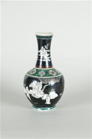 A porcelain Famille Noire and Famille verte vase with decoration of figures...