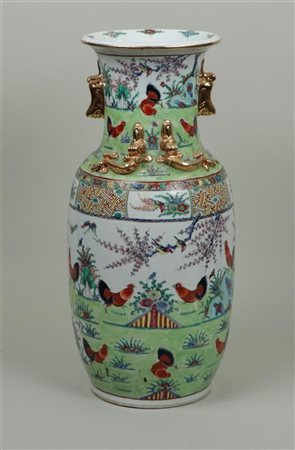 A porcelain canton baluster vase. China, mid 20th century.H. 46 cm.