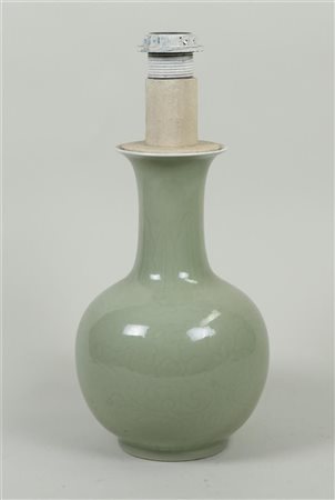 A celadon lamp base with relief decoration, marked on the bottom. China, 20th...