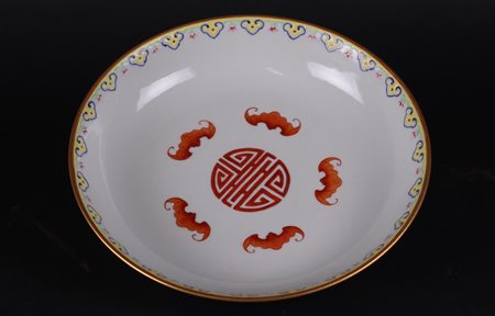 A porcelain Famille Rose plate with decoration of five bats around Shou sign...