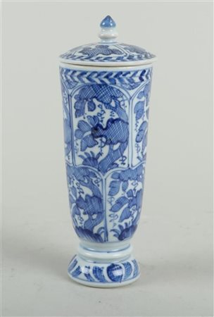 A porcelain bell-shaped covered vase with floral decoration in borders....