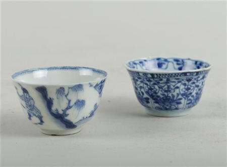 A lot of two cups, one with a decoration of a lady and gentleman on horseback...