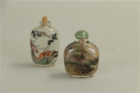 A lot consisting of (2) snuff bottles with rare representation of tiger in...