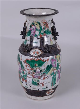 A Nanking earthenware vase with various figures decorated on it, marked on...