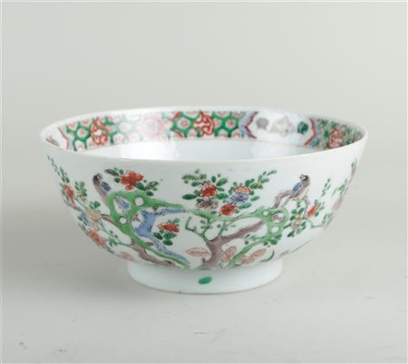 A porcelain famile verte bowl decorated with birds and flowers, on the inside...
