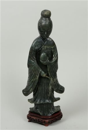 A jade figure of a Chinese lady. China, circa 1900. Foot is glued.H. 39 cm.