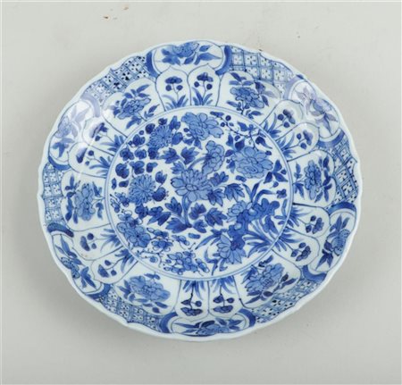 Porcelain lobed plate with rich floral decoration China, Kangxi marked...