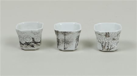 A set of three black painted cups, marked on the bottom. China, 19th...