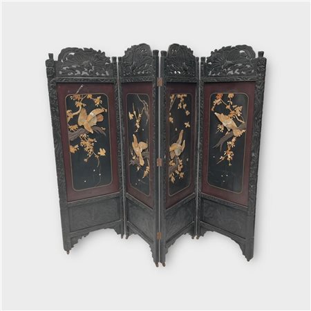 A large Chinese room screen decorated with birds of prey and branches in...