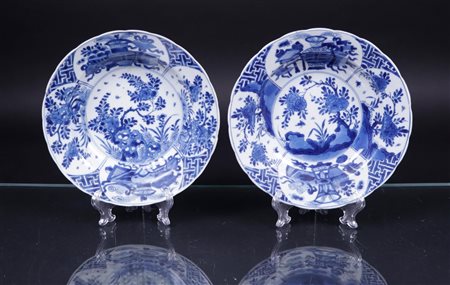 Two porcelain hooded plates with antique borders on the outside alternating...