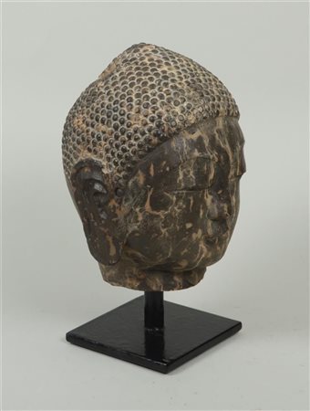 A carved stone head of the Buddha in Ming style. China 19/20th century.28 x...